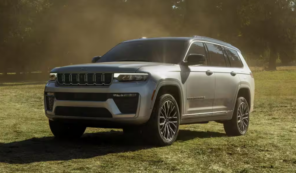 Silver 2026 Jeep Grand Cherokee parked on grass